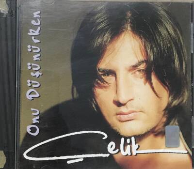 Çelik *Onu Düşünürken * ( İkinci El ) CD Müzik CD934 - 1