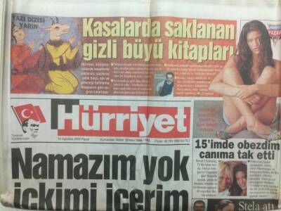 Hürriyet Gazetesi 14 Ağustos 2005 - Bikinili Kızlar Gökhan Özeni Terletti GZ29948 - 1